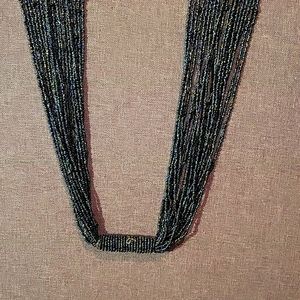 To be honest idk what this is. Its like a beaded scarf? Each side is 17 inch